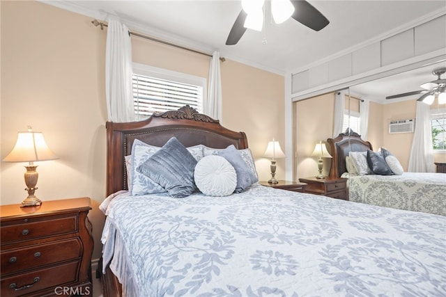 bedroom with crown molding, ceiling fan, and a closet