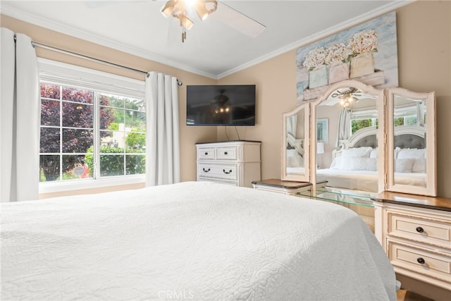 bedroom featuring ornamental molding and ceiling fan