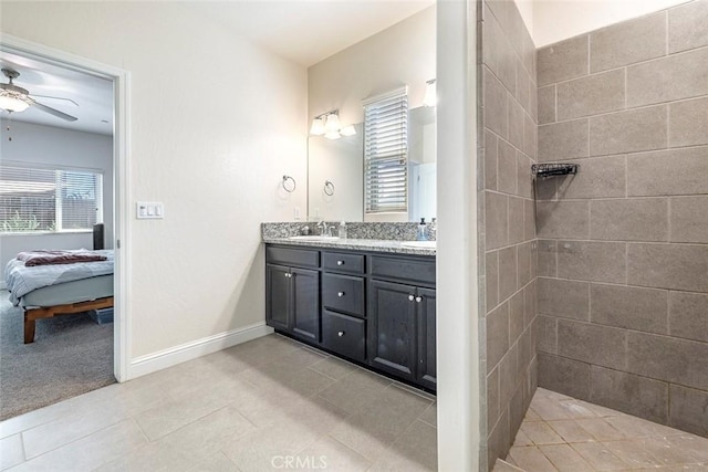 1628 N Delbert Ave, Fresno, CA 93722 - ensuite bathroom featuring a ceiling fan, a sink, double vanity, ensuite bath, and tiled shower