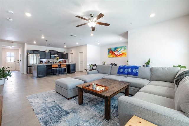 1628 N Delbert Ave, Fresno, CA 93722 - living room featuring a ceiling fan, visible vents, and recessed lighting