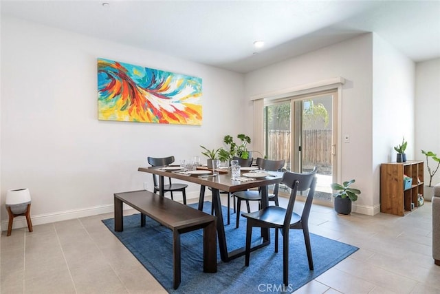 1628 N Delbert Ave, Fresno, CA 93722 - dining space featuring baseboards and light tile patterned floors