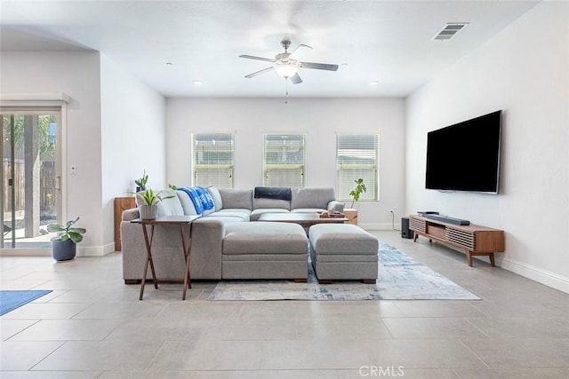 1628 N Delbert Ave, Fresno, CA 93722 - living area featuring light tile patterned floors, baseboards, ceiling fan, and visible vents