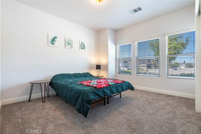 1628 N Delbert Ave, Fresno, CA 93722 - bedroom with baseboards, visible vents, and carpet