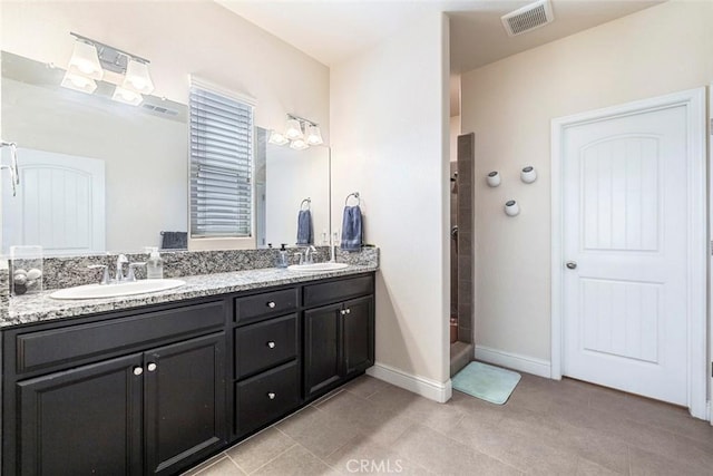 1628 N Delbert Ave, Fresno, CA 93722 - bathroom featuring tile patterned floors, visible vents, a sink, and double vanity