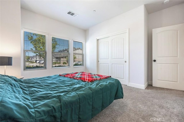 1628 N Delbert Ave, Fresno, CA 93722 - carpeted bedroom featuring baseboards, visible vents, and a closet