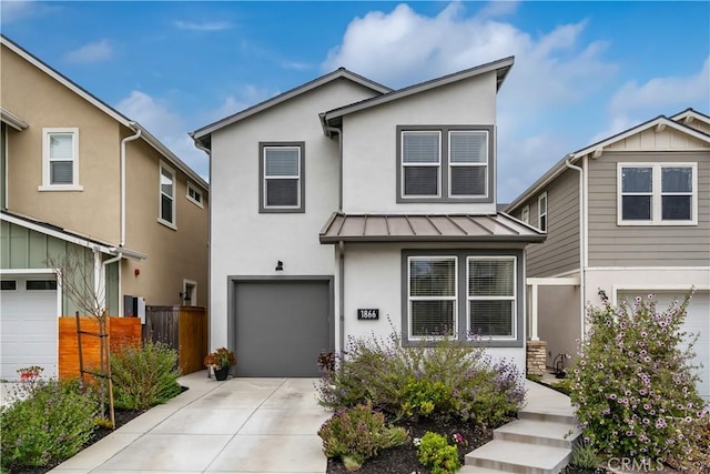 1866 Homestead Pl, San Luis Obispo, CA 93405 - view of front of home with an attached garage, stucco siding, a standing seam roof, concrete driveway, and fence