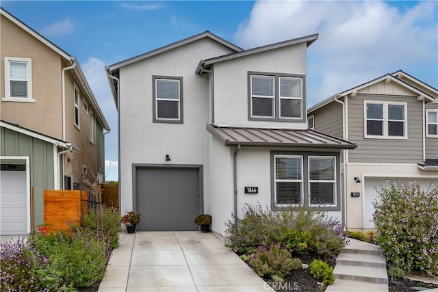 1866 Homestead Pl, San Luis Obispo, CA 93405 - view of front of home with a garage, stucco siding, a standing seam roof, fence, and concrete driveway