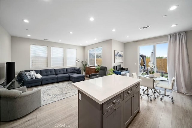 1866 Homestead Pl, San Luis Obispo, CA 93405 - kitchen with light wood finished floors, gray cabinets, healthy amount of natural light, a center island, and recessed lighting
