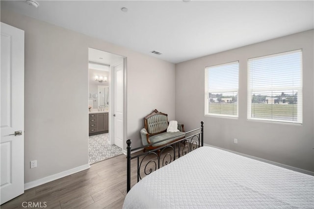 1866 Homestead Pl, San Luis Obispo, CA 93405 - bedroom featuring wood finished floors, baseboards, and connected bathroom