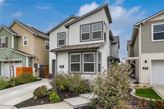 1866 Homestead Pl, San Luis Obispo, CA 93405 - view of front facade with a standing seam roof, stucco siding, concrete driveway, and an attached garage