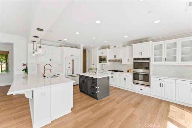2836 Mesa Grove Rd, Fallbrook, CA 92028 - kitchen with stainless steel appliances, crown molding, a sink, light countertops, and white cabinets
