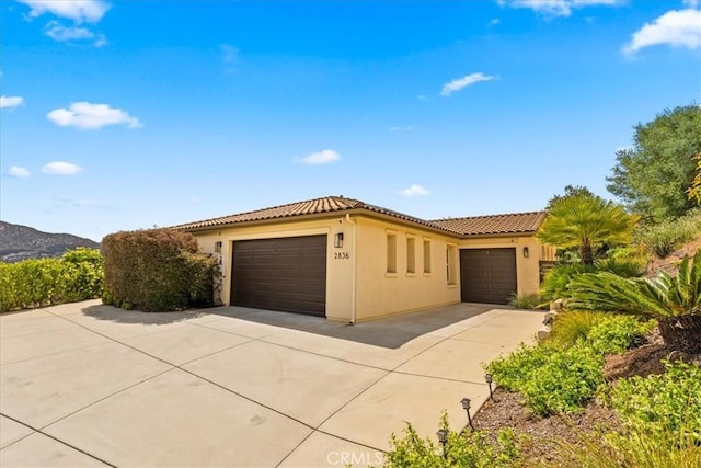2836 Mesa Grove Rd, Fallbrook, CA 92028 - mediterranean / spanish-style home featuring a tiled roof, stucco siding, driveway, and an attached garage