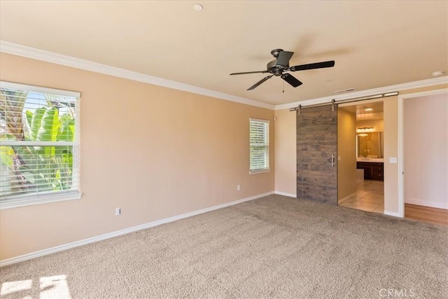 2836 Mesa Grove Rd, Fallbrook, CA 92028 - unfurnished bedroom with a barn door, carpet floors, crown molding, and baseboards