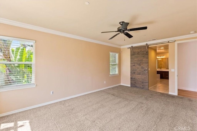 2836 Mesa Grove Rd, Fallbrook, CA 92028 - unfurnished bedroom with a barn door, carpet floors, and crown molding