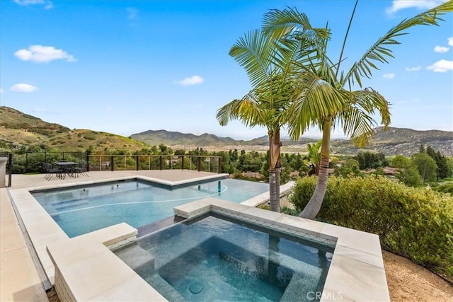 2836 Mesa Grove Rd, Fallbrook, CA 92028 - view of pool with a mountain view, a pool with connected hot tub, and fence