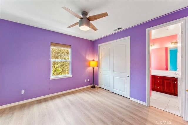 2836 Mesa Grove Rd, Fallbrook, CA 92028 - unfurnished bedroom with light wood-style flooring, a closet, ensuite bathroom, and ceiling fan