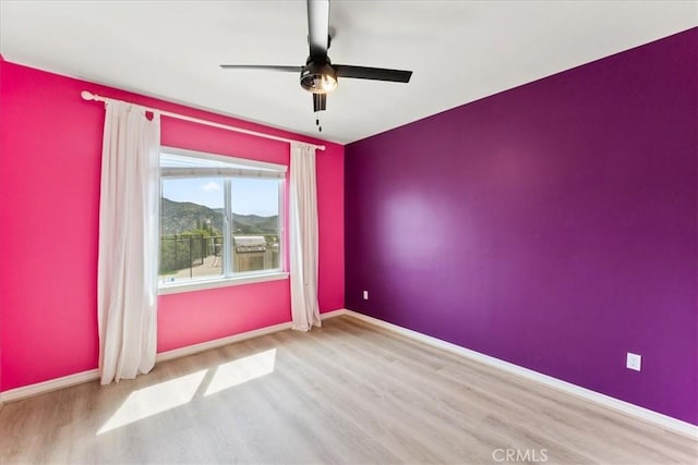 2836 Mesa Grove Rd, Fallbrook, CA 92028 - empty room with wood finished floors, a ceiling fan, and a mountain view