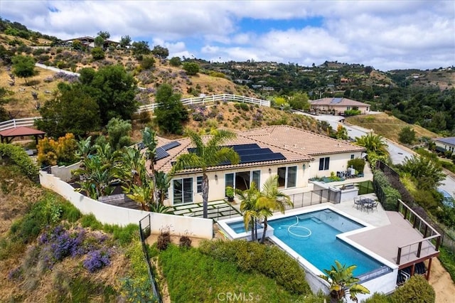 2836 Mesa Grove Rd, Fallbrook, CA 92028 - rear view of property with a fenced backyard, roof mounted solar panels, a tile roof, a patio area, and stucco siding