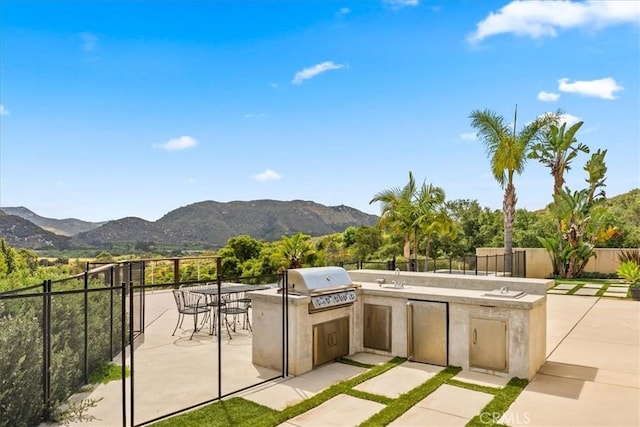2836 Mesa Grove Rd, Fallbrook, CA 92028 - view of patio / terrace featuring exterior kitchen, a mountain view, and outdoor dining area