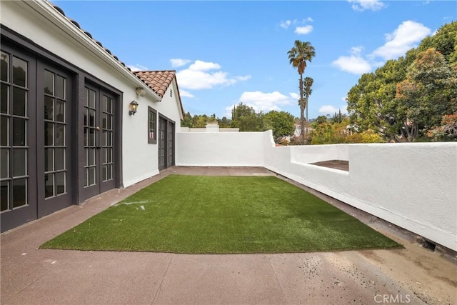 view of yard with a patio and a fenced backyard