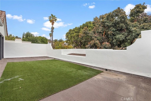 view of yard with a fenced backyard and a patio