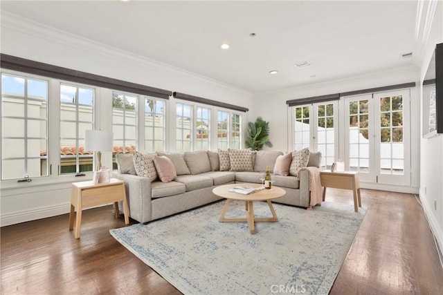 living area featuring crown molding, french doors, baseboards, dark wood-style flooring, and recessed lighting