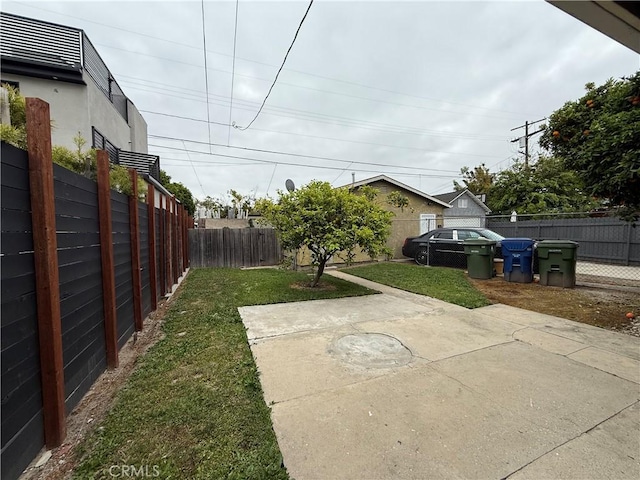 view of yard featuring a fenced backyard and a patio area