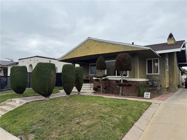 5442 6th Ave, Los Angeles, CA 90043 - view of front of home with a front lawn, a porch, and stucco siding