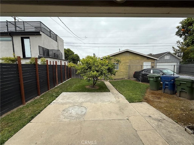 view of yard with a patio and a fenced backyard