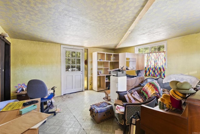 interior space with tile patterned floors and a textured ceiling