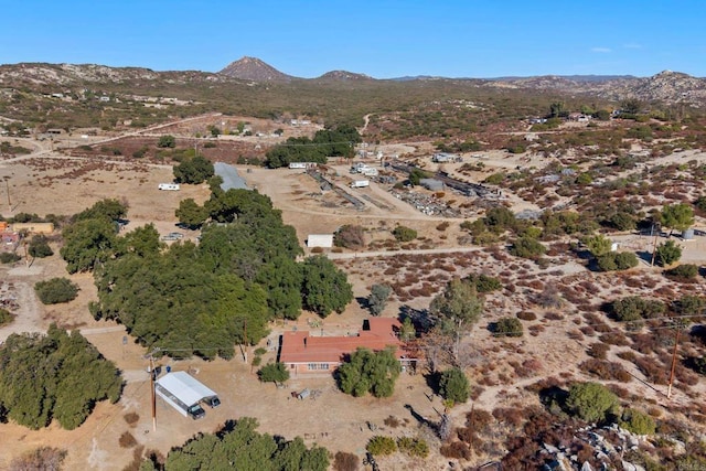 bird's eye view with a rural view, view of desert, and a mountain view