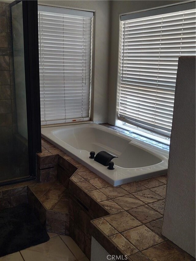 9373 Nevada Rd, Phelan, CA 92371 - bathroom featuring a bath and a stall shower