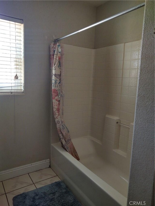 9373 Nevada Rd, Phelan, CA 92371 - bathroom featuring shower / bath combination with curtain, tile patterned flooring, and baseboards
