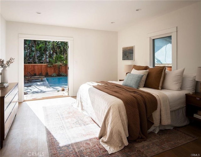 3702 Seneca Ave, Los Angeles, CA 90039 - bedroom with wood finished floors, access to outside, recessed lighting, and multiple windows