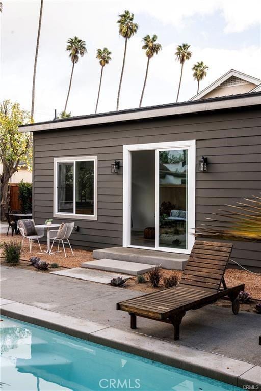 3702 Seneca Ave, Los Angeles, CA 90039 - rear view of house featuring an outdoor pool and a patio