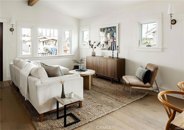 3702 Seneca Ave, Los Angeles, CA 90039 - sitting room with wood finished floors, baseboards, and lofted ceiling with beams