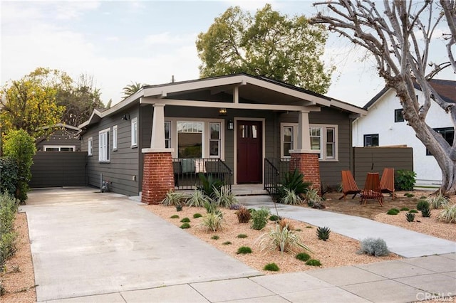 3702 Seneca Ave, Los Angeles, CA 90039 - craftsman-style home with concrete driveway, fence, and a porch