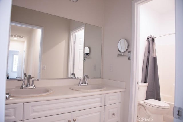 1334 Pinehurst Dr, Calimesa, CA 92320 - bathroom featuring double vanity, visible vents, toilet, and a sink