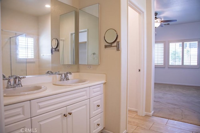 1334 Pinehurst Dr, Calimesa, CA 92320 - bathroom featuring baseboards, ceiling fan, double vanity, and a sink