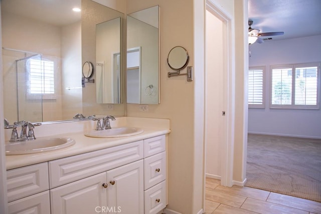 1334 Pinehurst Dr, Calimesa, CA 92320 - full bathroom featuring double vanity, a ceiling fan, baseboards, and a shower with shower door