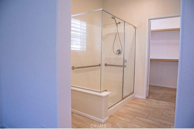 1334 Pinehurst Dr, Calimesa, CA 92320 - full bathroom with a shower stall, baseboards, and a walk in closet