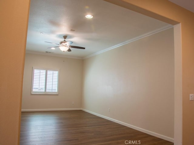 1334 Pinehurst Dr, Calimesa, CA 92320 - spare room featuring baseboards, a ceiling fan, dark wood-style flooring, and crown molding