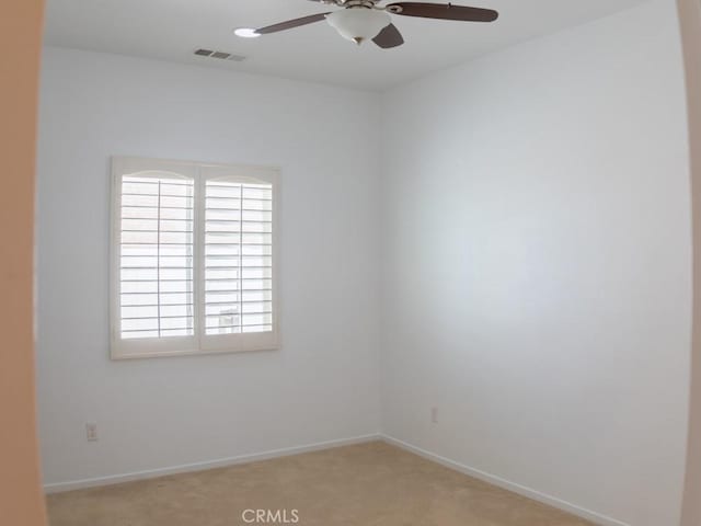 1334 Pinehurst Dr, Calimesa, CA 92320 - spare room with a ceiling fan, light colored carpet, and a healthy amount of sunlight