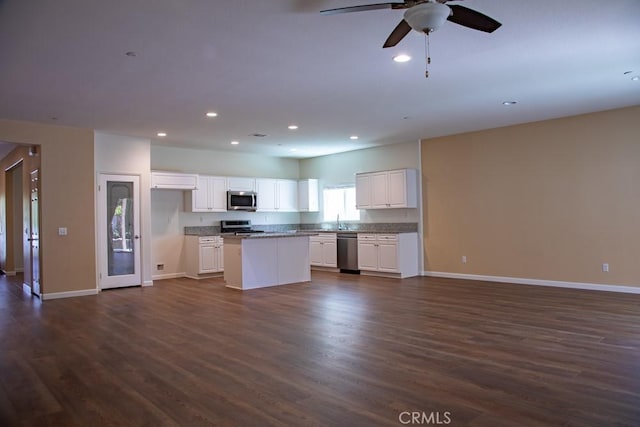 1334 Pinehurst Dr, Calimesa, CA 92320 - kitchen featuring open floor plan, stainless steel appliances, dark wood-style floors, and baseboards