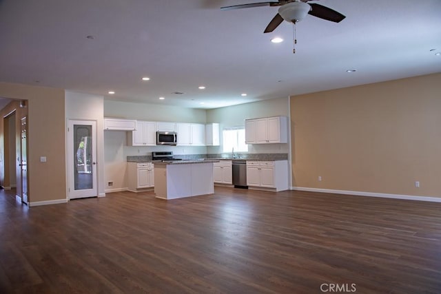 1334 Pinehurst Dr, Calimesa, CA 92320 - kitchen with appliances with stainless steel finishes, open floor plan, baseboards, dark wood finished floors, and recessed lighting