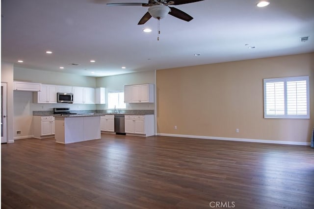1334 Pinehurst Dr, Calimesa, CA 92320 - kitchen with appliances with stainless steel finishes, baseboards, recessed lighting, and open floor plan
