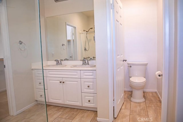 1334 Pinehurst Dr, Calimesa, CA 92320 - full bathroom with double vanity, toilet, tile patterned floors, and baseboards