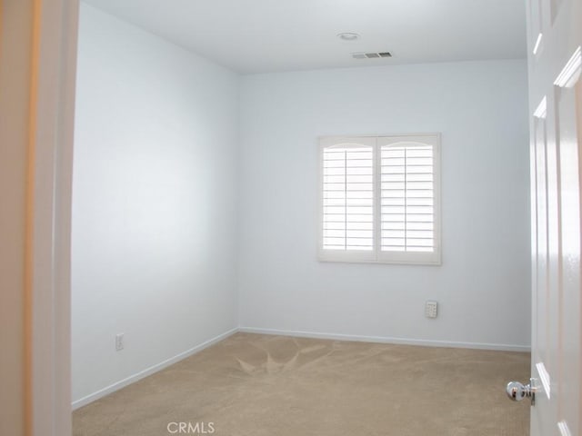 1334 Pinehurst Dr, Calimesa, CA 92320 - spare room featuring baseboards, visible vents, and light colored carpet