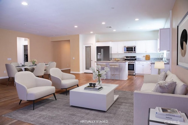 1334 Pinehurst Dr, Calimesa, CA 92320 - living room featuring wood finished floors, recessed lighting, and baseboards