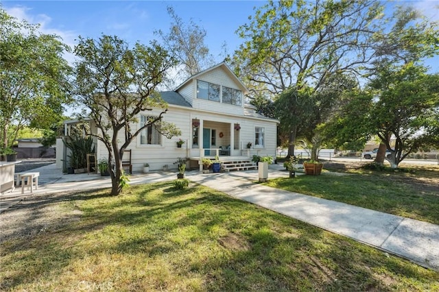318 E 11th St, Pomona, CA 91766 - view of front facade with a front yard and covered porch